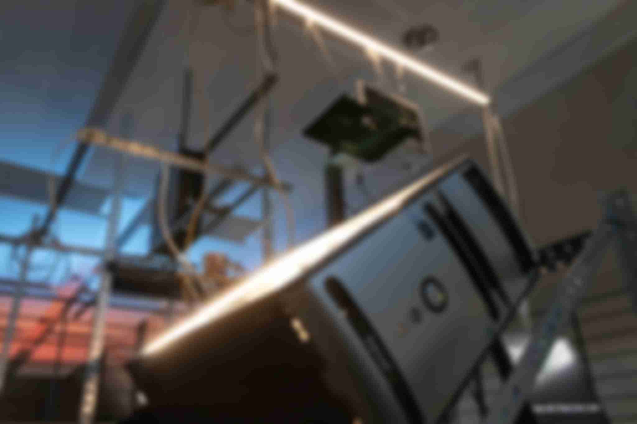 A picture taken from the bottom to the top of the /sys/net/visible installation. It shows a desktop PC close up with the rest of the installation in the background.