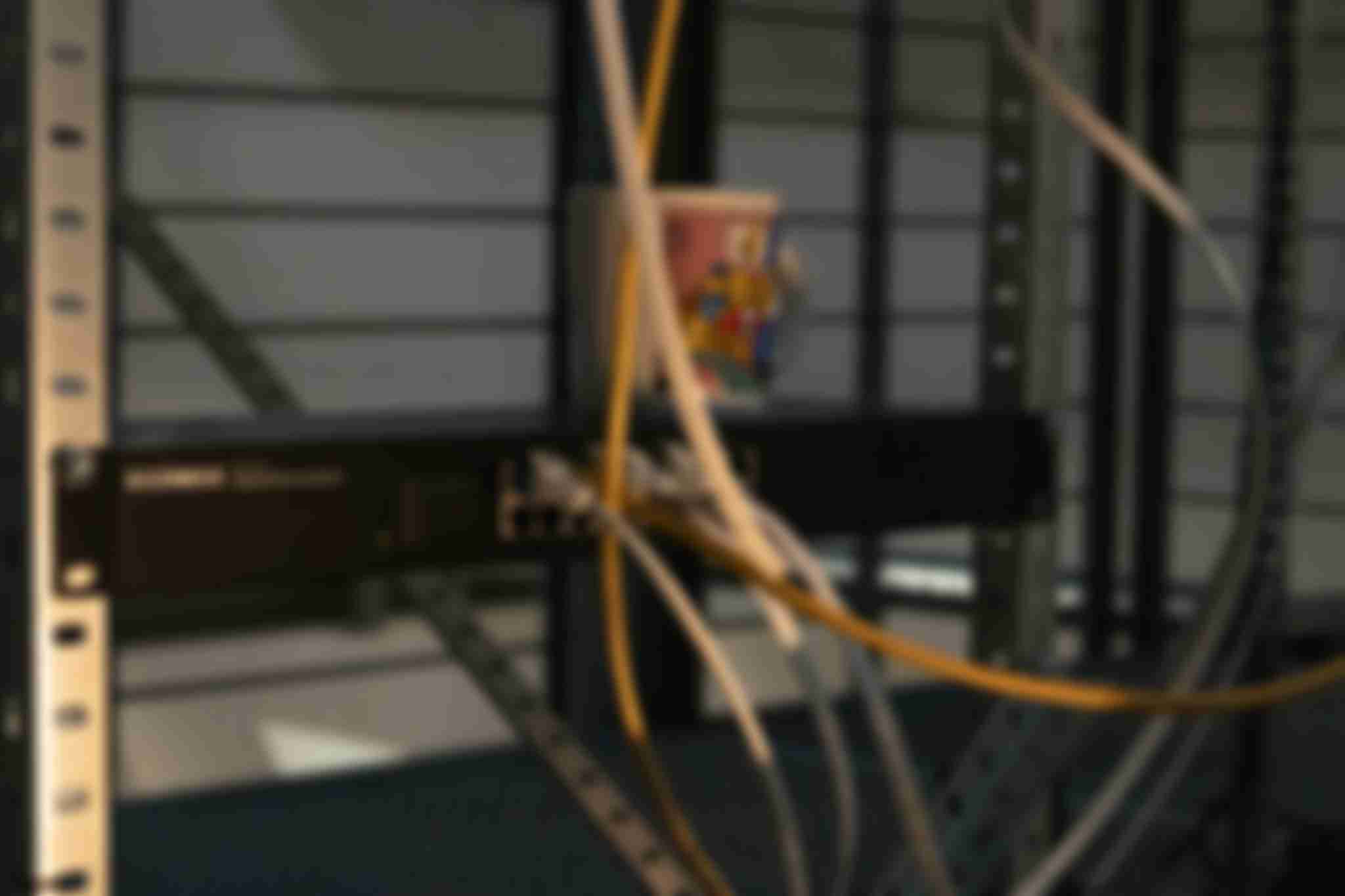 A close-up of the network switch being mounted inside aluminium profiles, becoming an integral part of the /sys/net/visible installation.