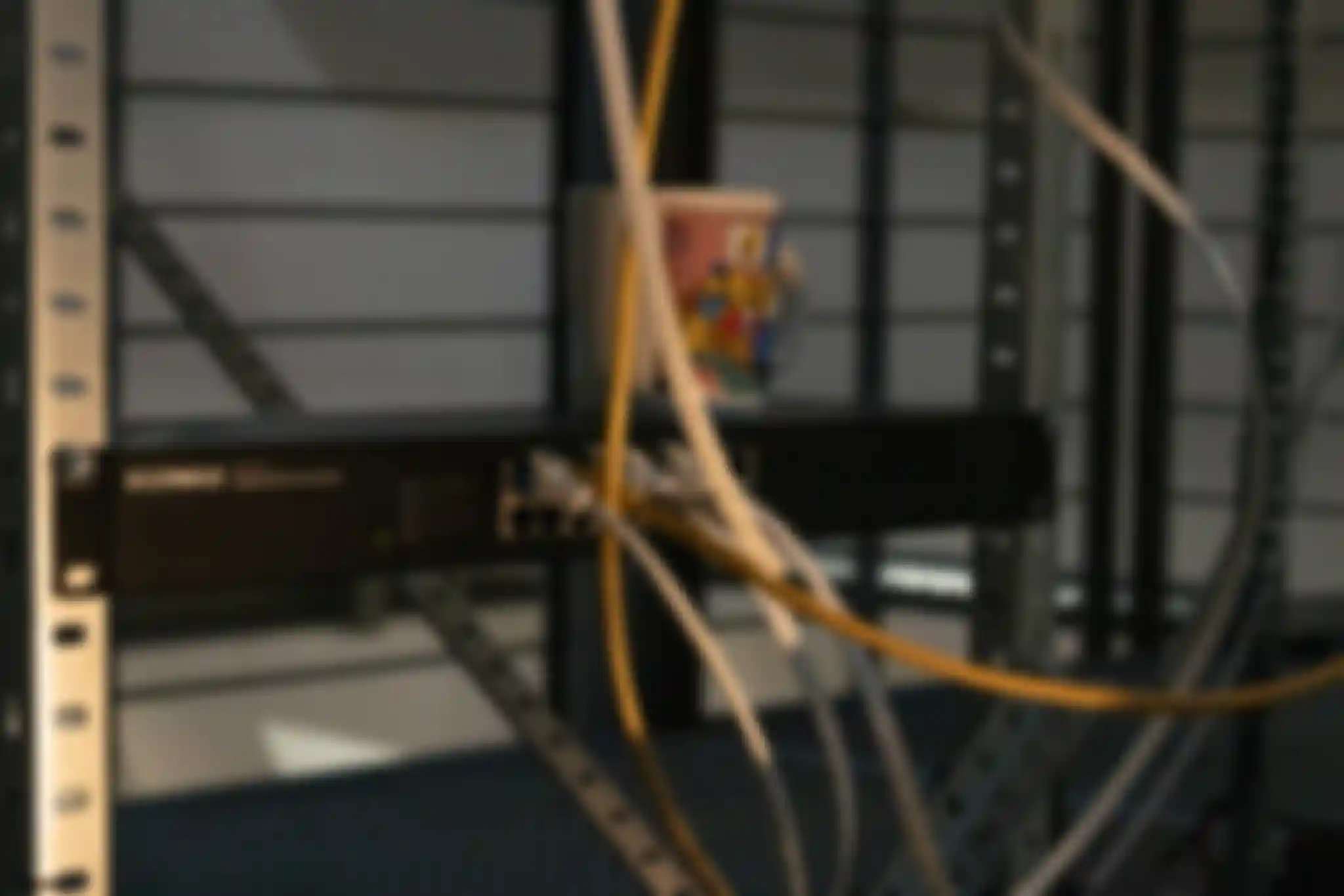 A close-up of the network switch being mounted inside aluminium profiles, becoming an integral part of the /sys/net/visible installation.